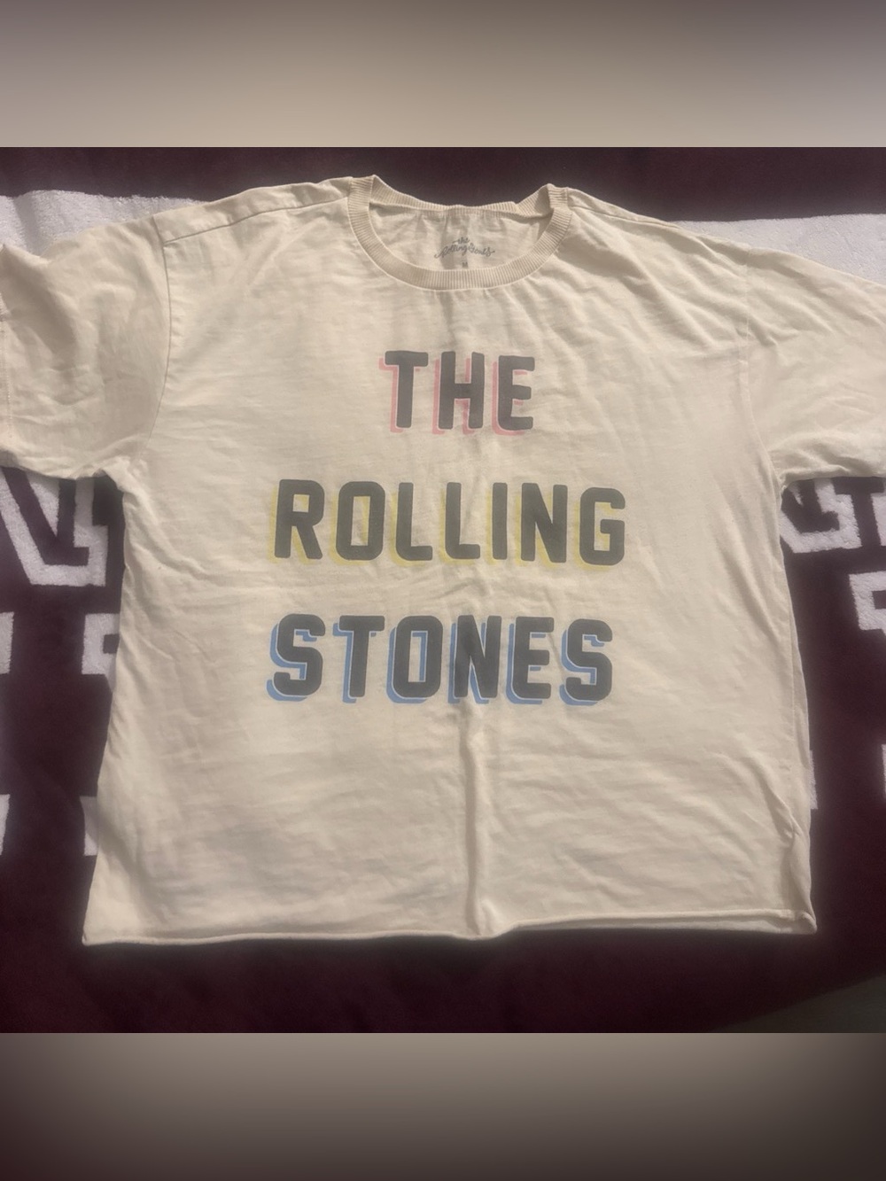 the Rolling Stones Cream Graphic Tee with Multicolor Lettering